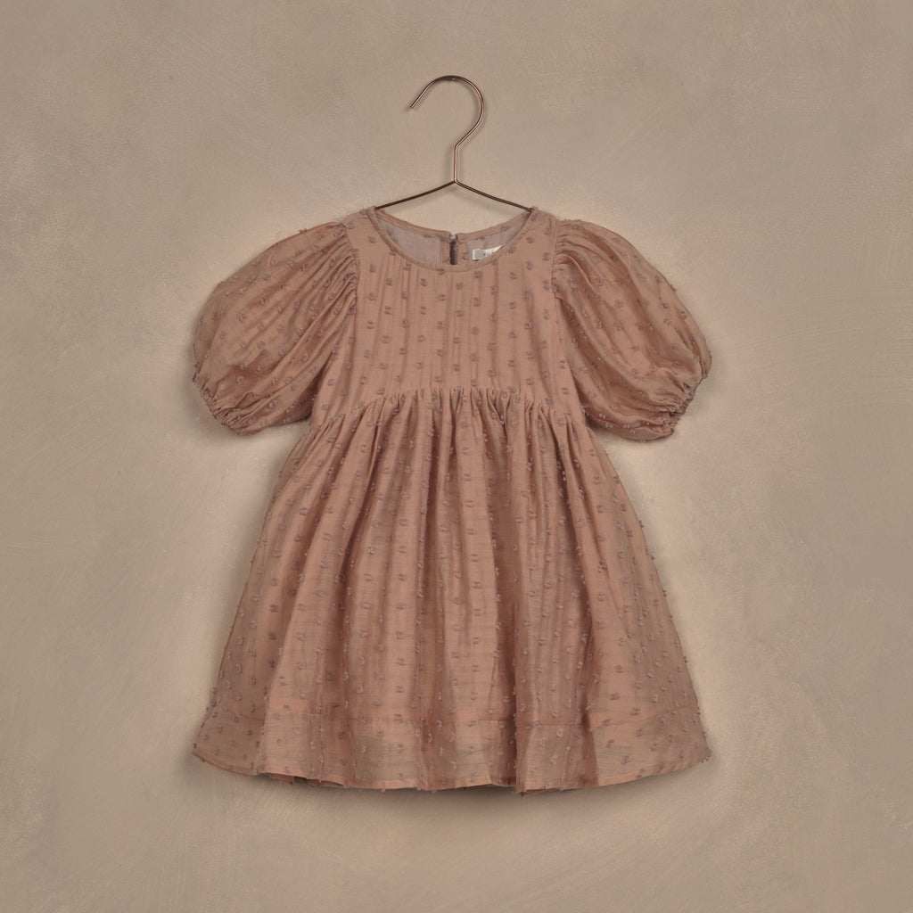 faltlay of rose dress on hanger