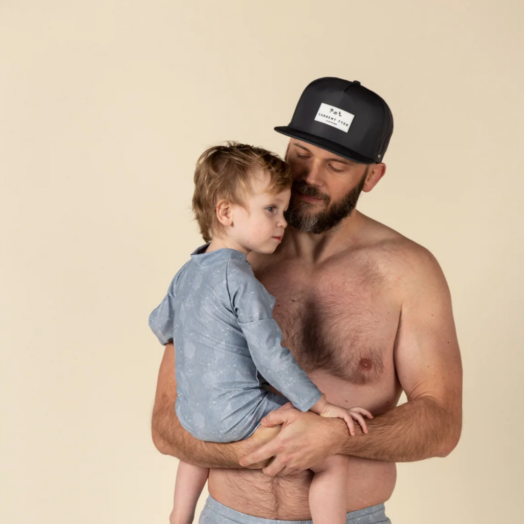 Adult Made For Shae'd Waterproof Snapbacks by Current Tyed Clothing dad holding baby in beige studio