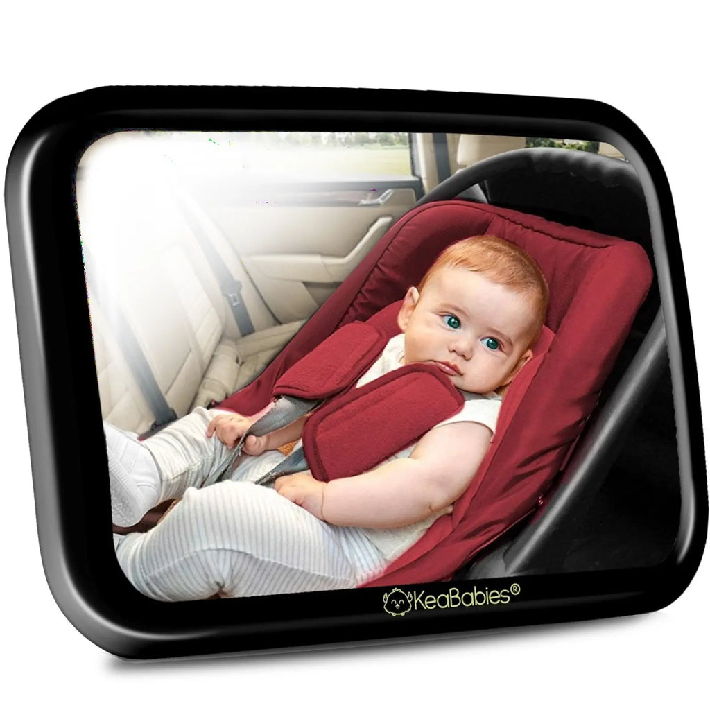 White background with Car Seat Mirror by KeaBabies. Mirror is angled showing a baby sitting in her car seat.