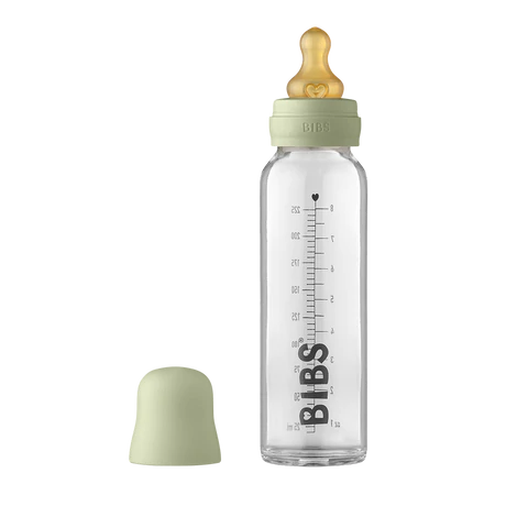 225 ml Glass bottle that says "BIBS" in black along the side, with a sage bottle lid by Bibs