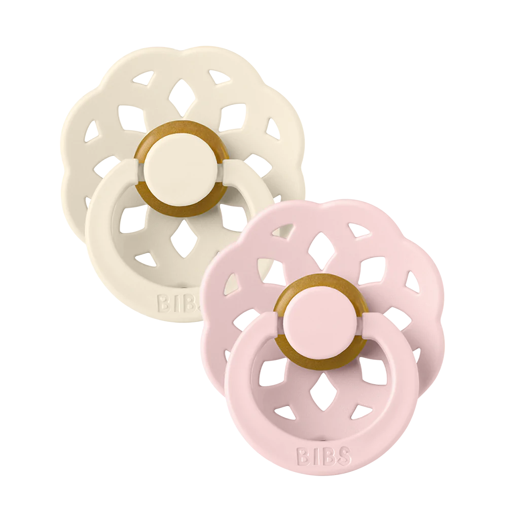Clear background with the Boheme Size 2 Pacifier in Ivory & Blossom by Bibs. Set comes with an ivory, and pale pink pacifier.