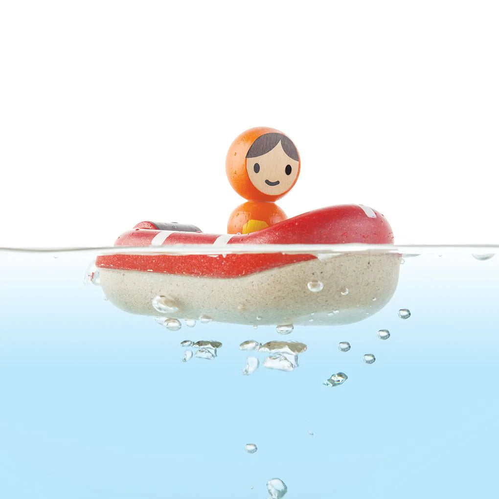 Showing the Coastguard Boat by PlanToys submerged in water.
