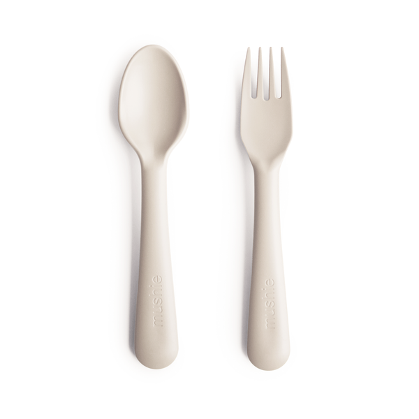 White background with Fork and Spoon Set in Ivory by Mushie. They come in a beautiful stark white colour.
