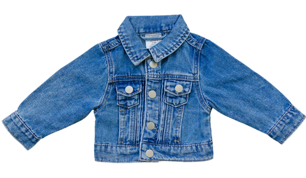 White background with Mebie Baby Jean Jacket by Mebie Baby. Jean jacket is a medium denim, with buttons down the front and 2 button front chest pockets.