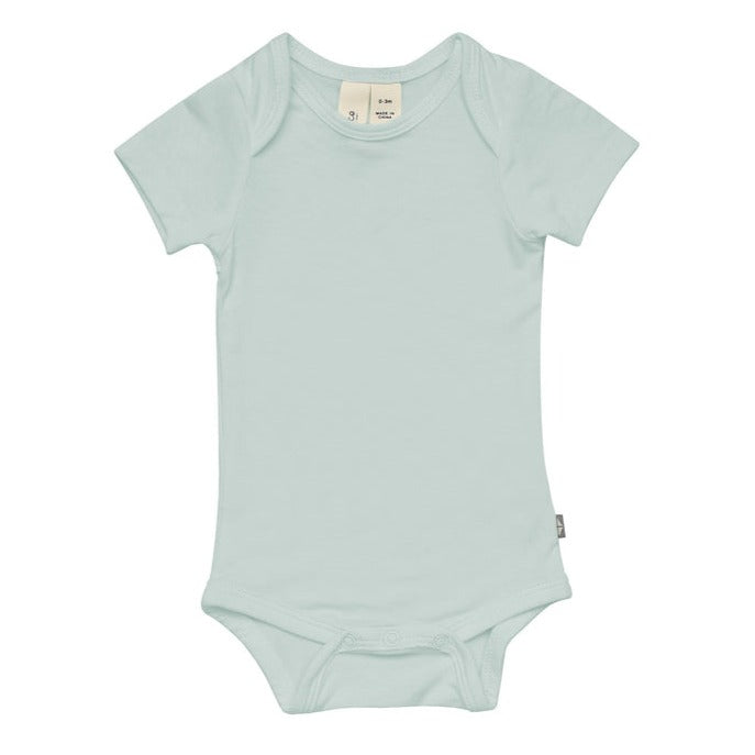 White background with Bodysuit in Sage by Kyte Baby. Has snap closure at the bottom.