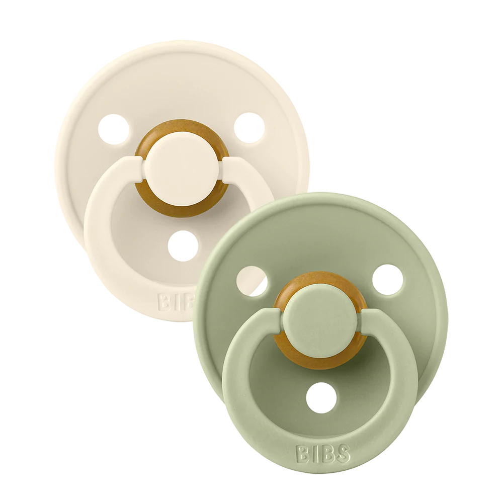 Clear background with the Size 1 Pacifiers in Sage & Ivory by Bibs. Set comes with 1 ivory pacifier, and 1 sage pacifier.