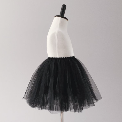 Baby Celine Tutu in Black by Bluish on a mannequin in front of a grey wall 