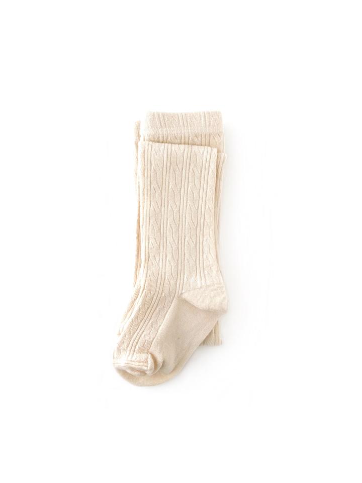 White background with Cable Knit Tights in Vanilla by Little Stocking Co.