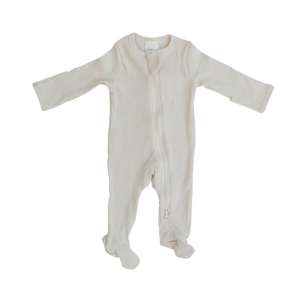 White background with Vanilla Organic Cotton Footed Zipper One-Piece by Mebie Baby.
