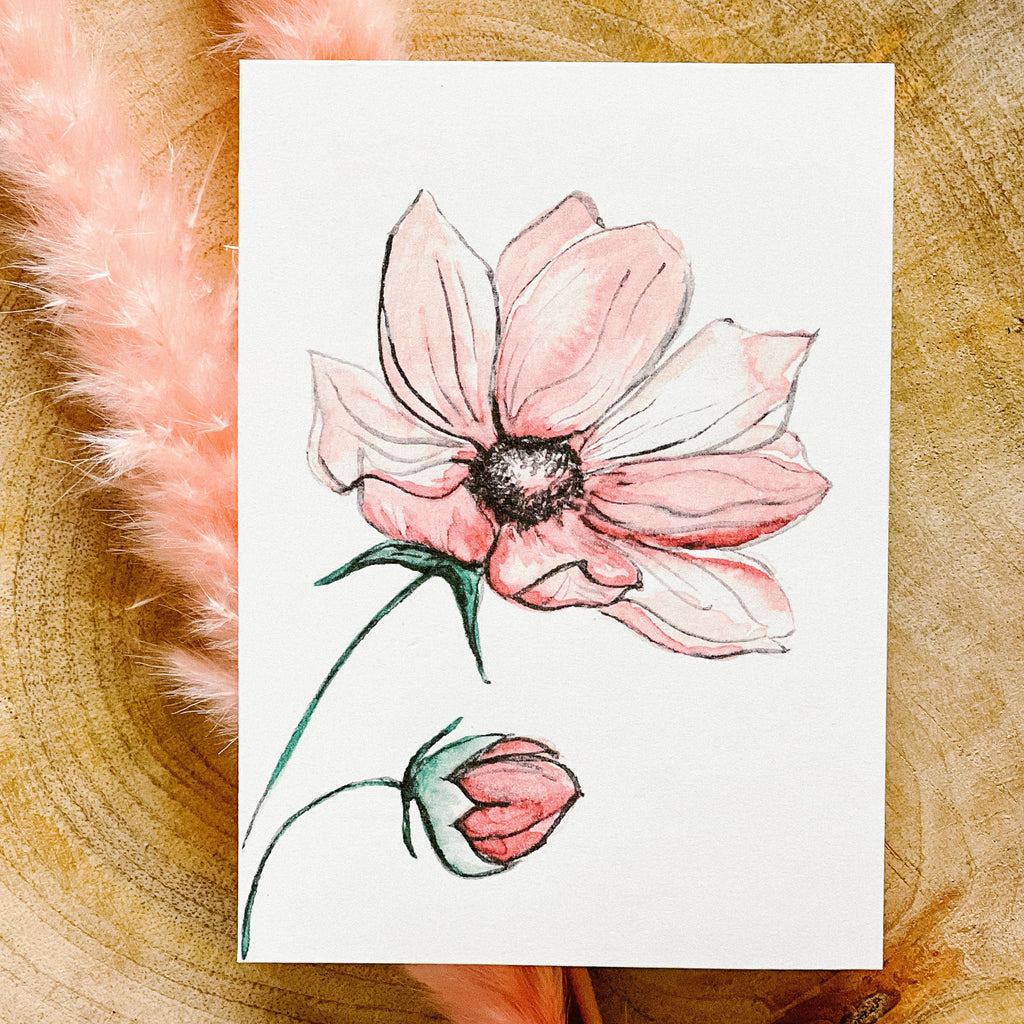 Poppy | Motherhood card by PARKES & bash, on a wooden surface with pink pampas grass. 