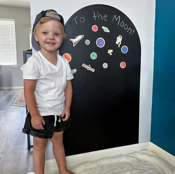 little boy with black arch decal wall 