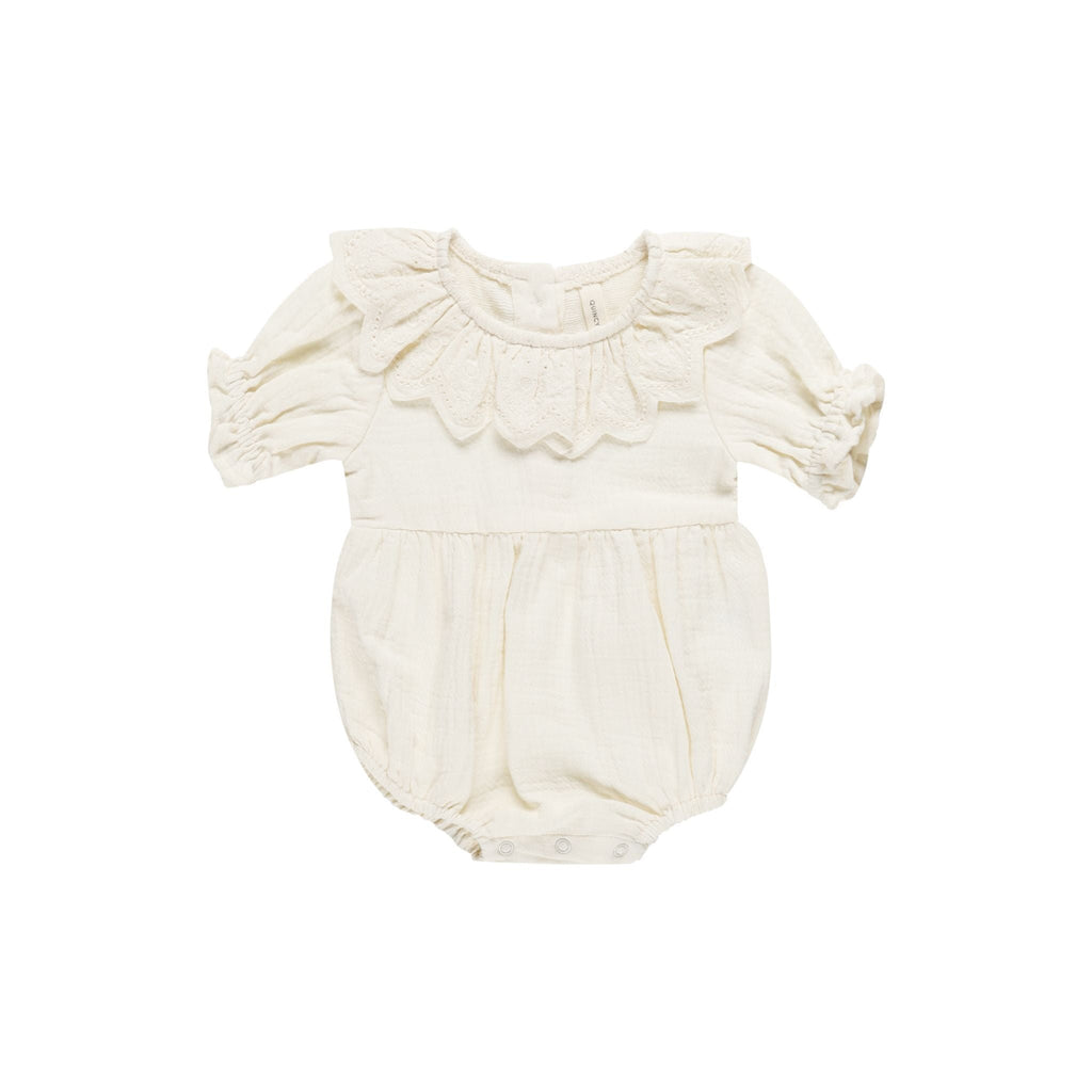 flatlay of collared romper in ivory on white background 