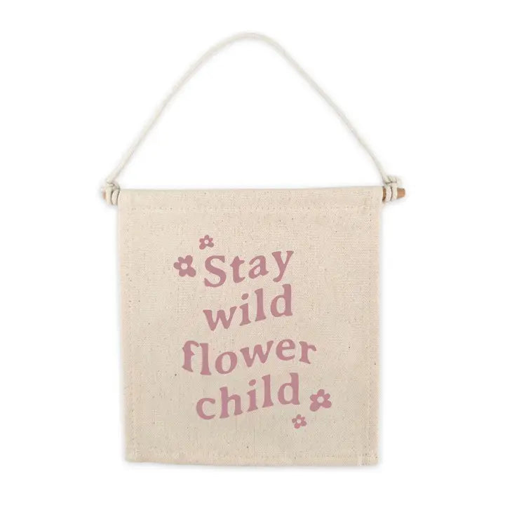 flatlay of stay wild flower child on white background 