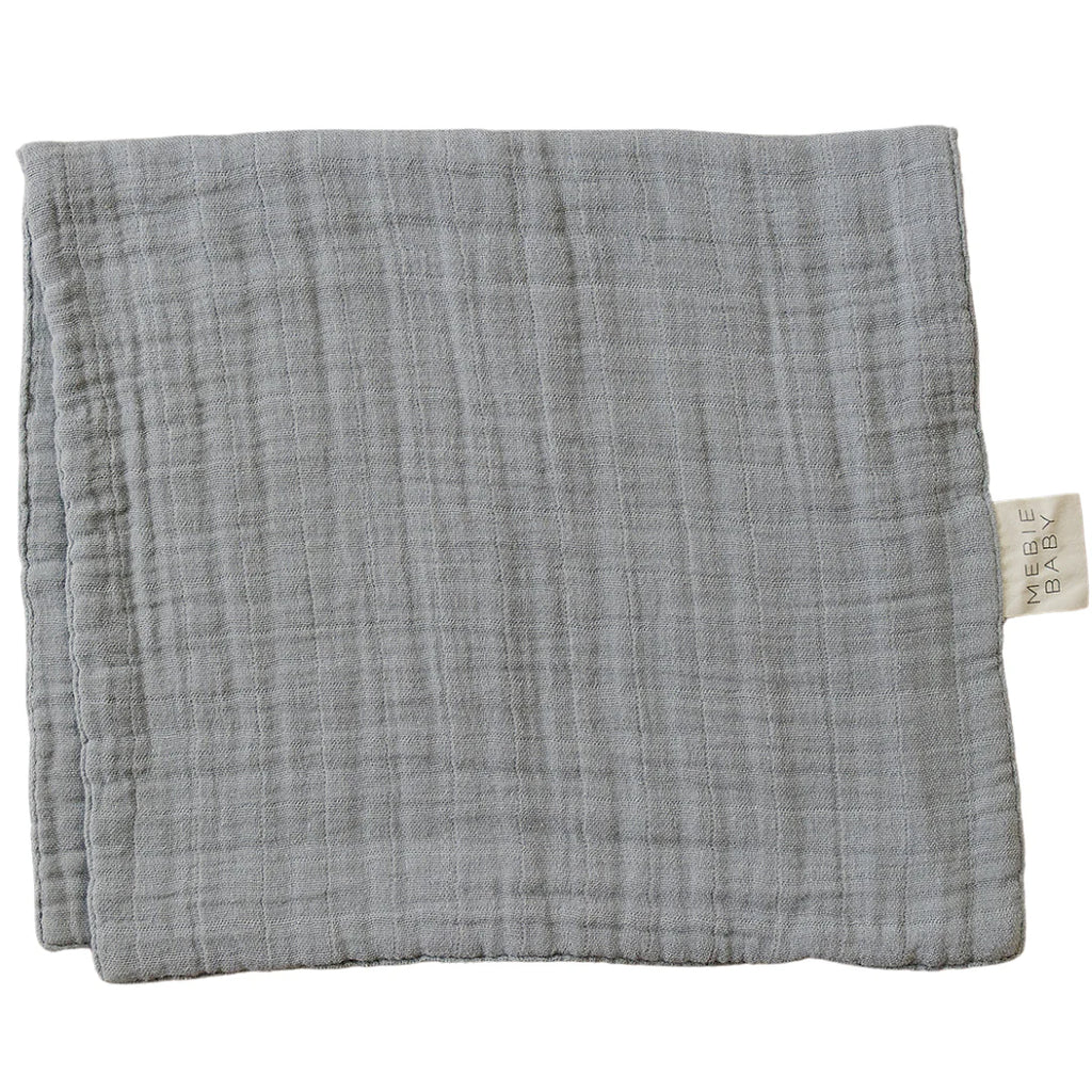 dusty blue burp cloth flatlay 