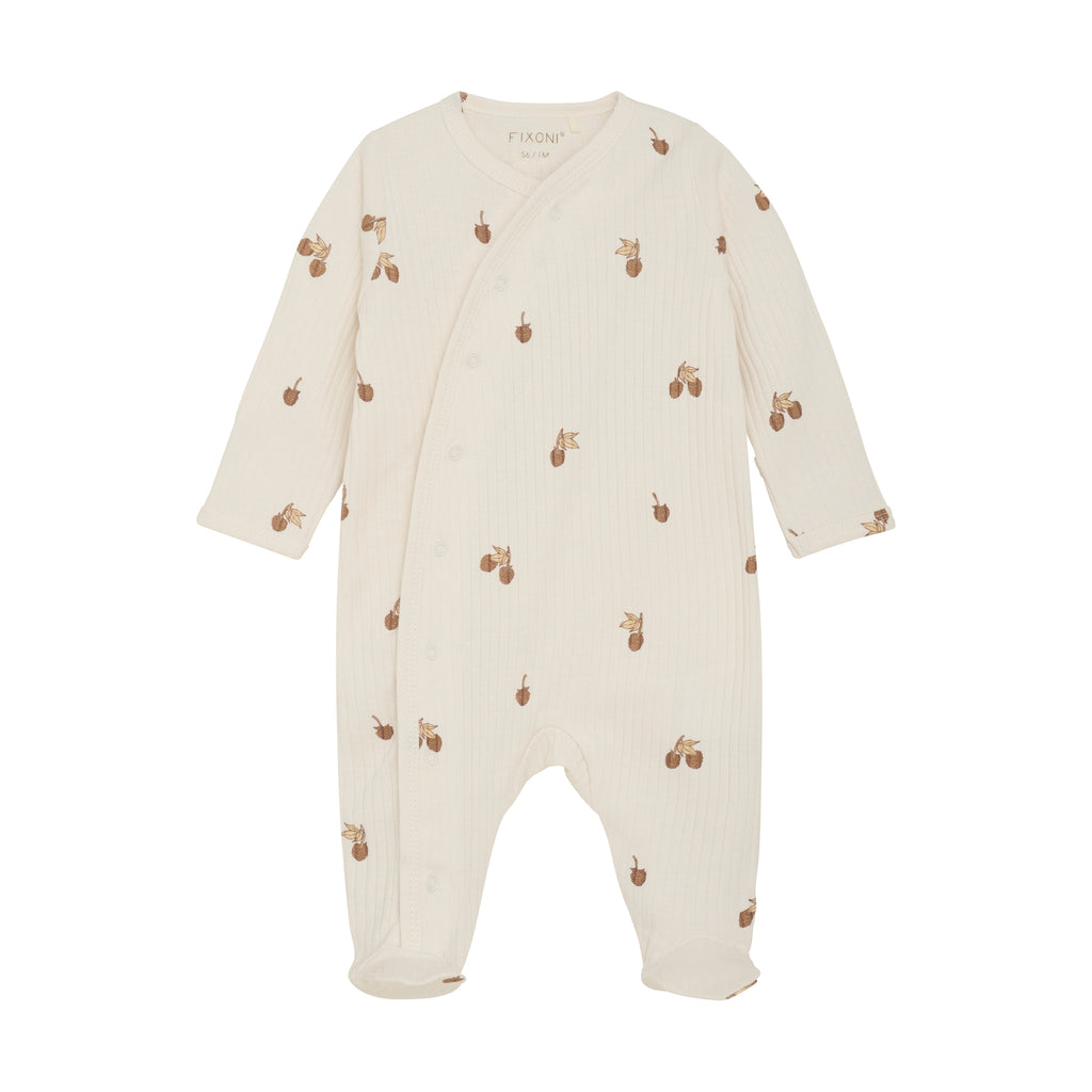 cream rib sleeper with snaps and acorns flat lay
