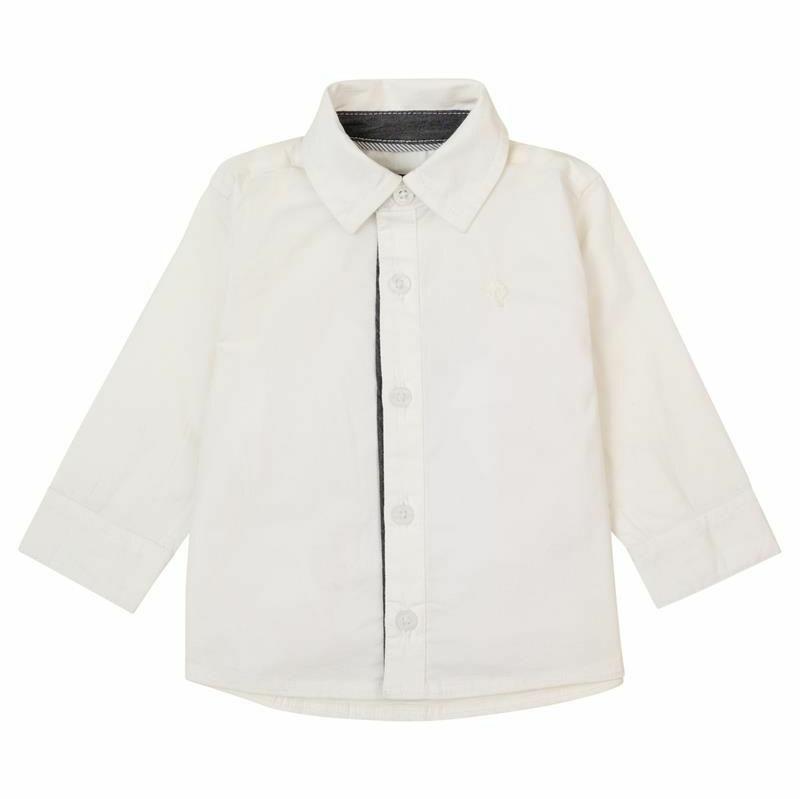 flatlay of white dress shirt on white background 