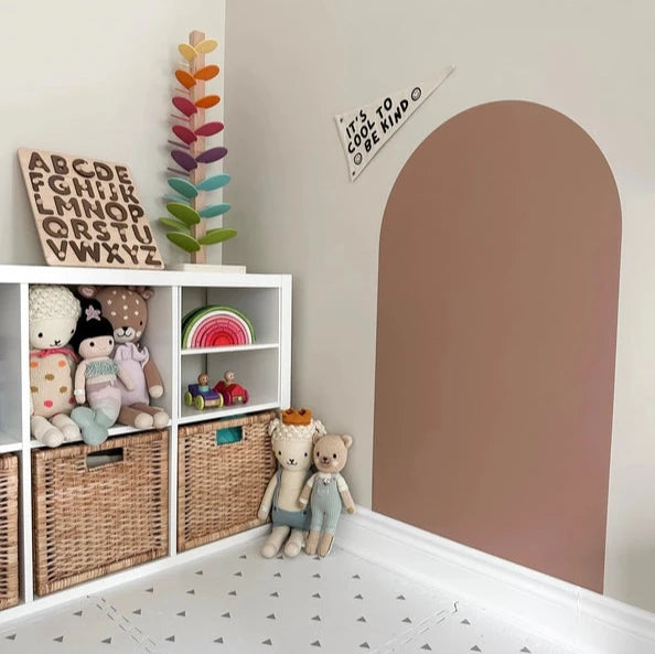 caramel decal wall with stuffies and baskets 