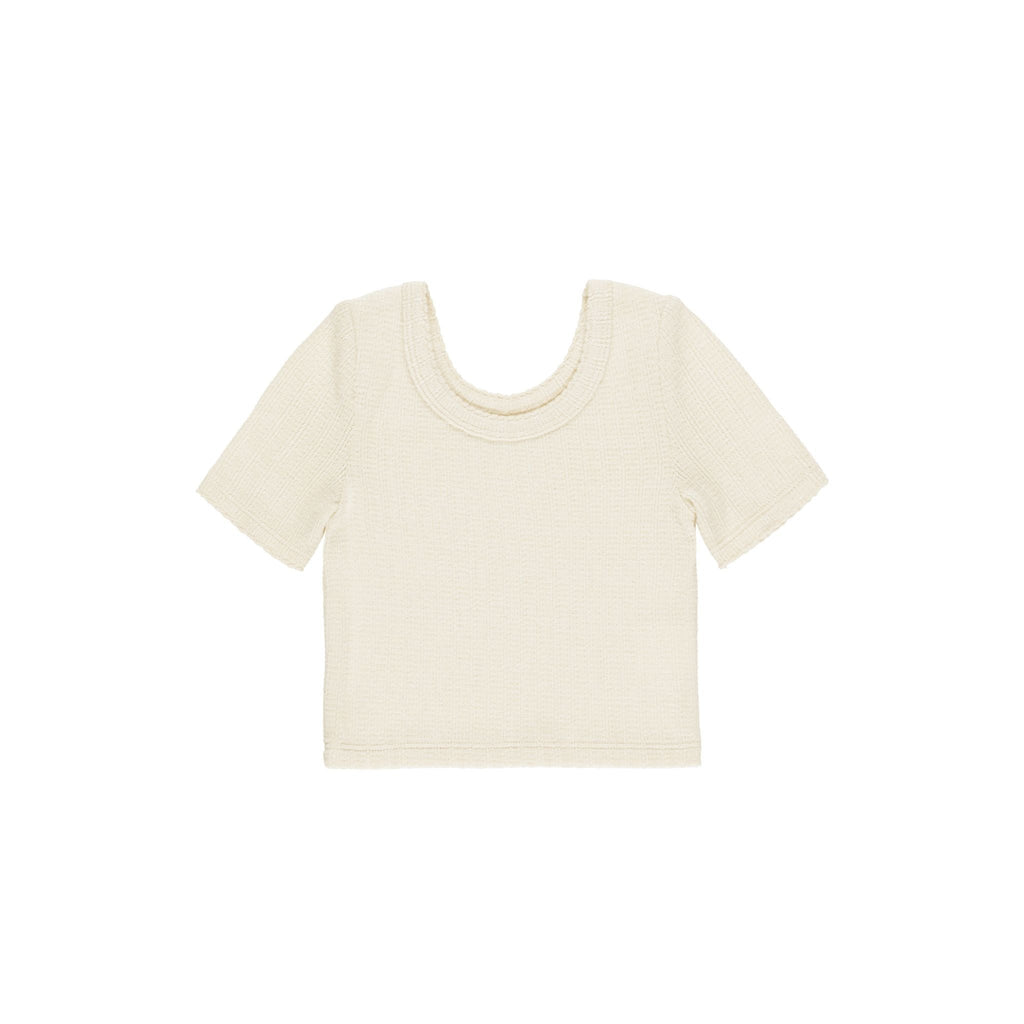 flatlay natural scalloped tee on white background 