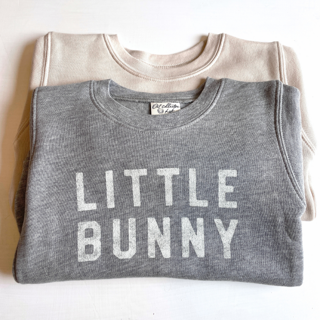 grey little bunny crew flat lay with beige crew behind it.