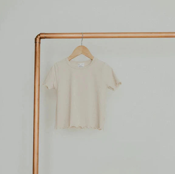 lettuce hem tee in bone on gold rack white background 