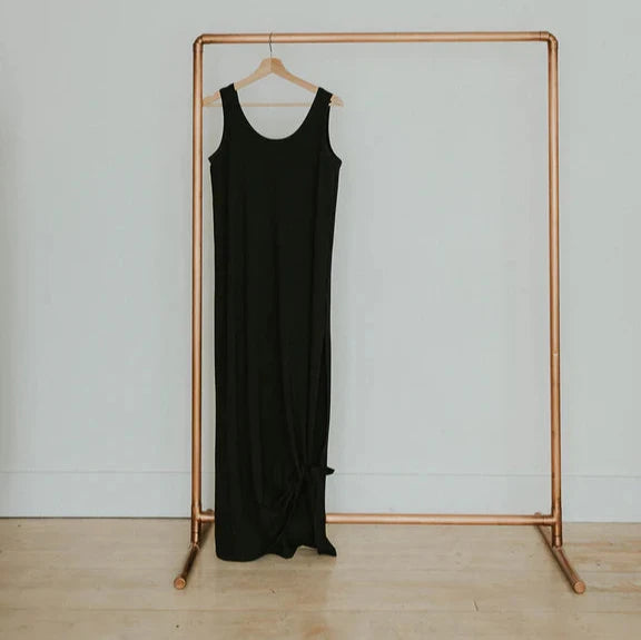 black maxi dress on gold hanger rack 