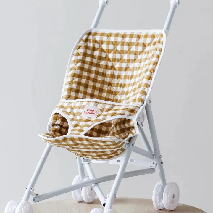 stroller flatlay in mustard gingham print 