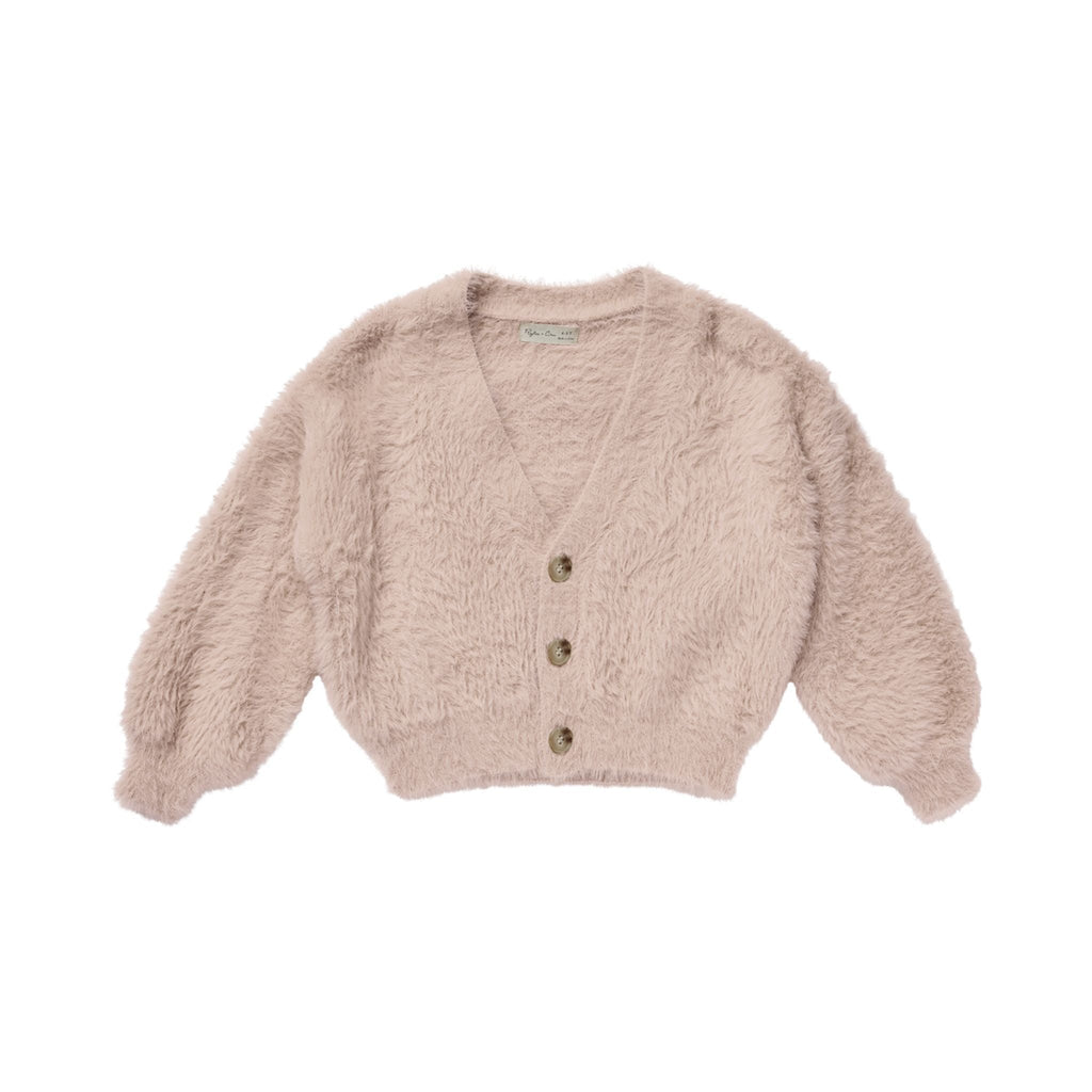 flatlay of blush fuzzy cardigan white background