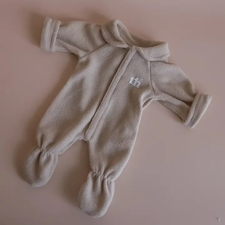 flatlay of taupe onesie for dolls 