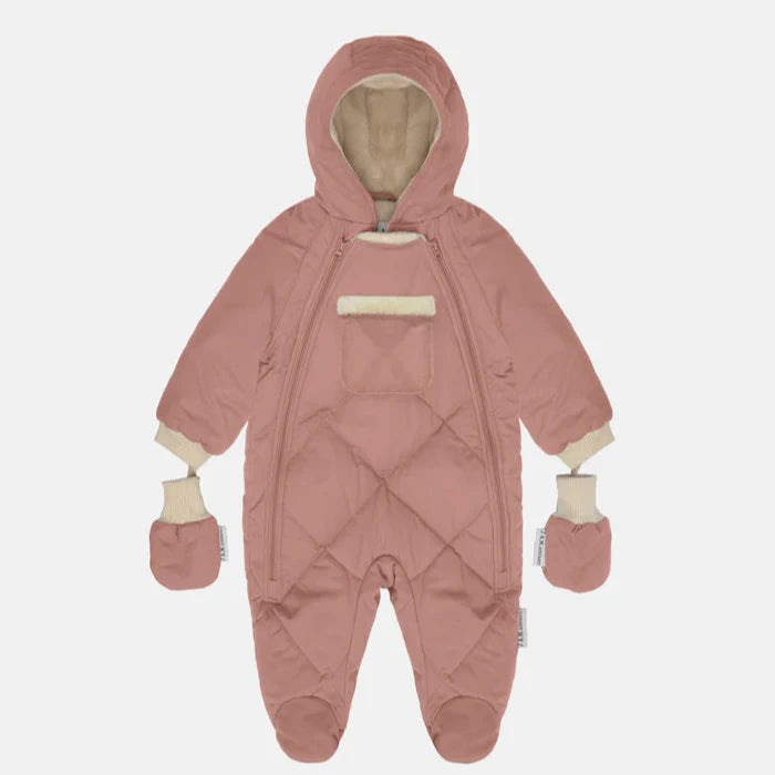 flatlay of snowsuit in pink dawn on white background 