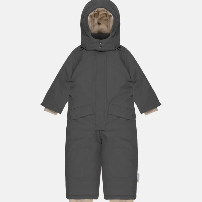 flatlay of smokey snowsuit on white background