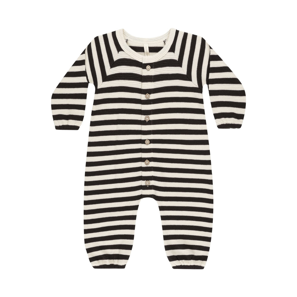 flatlay of black and white stripe waffle romper on white background