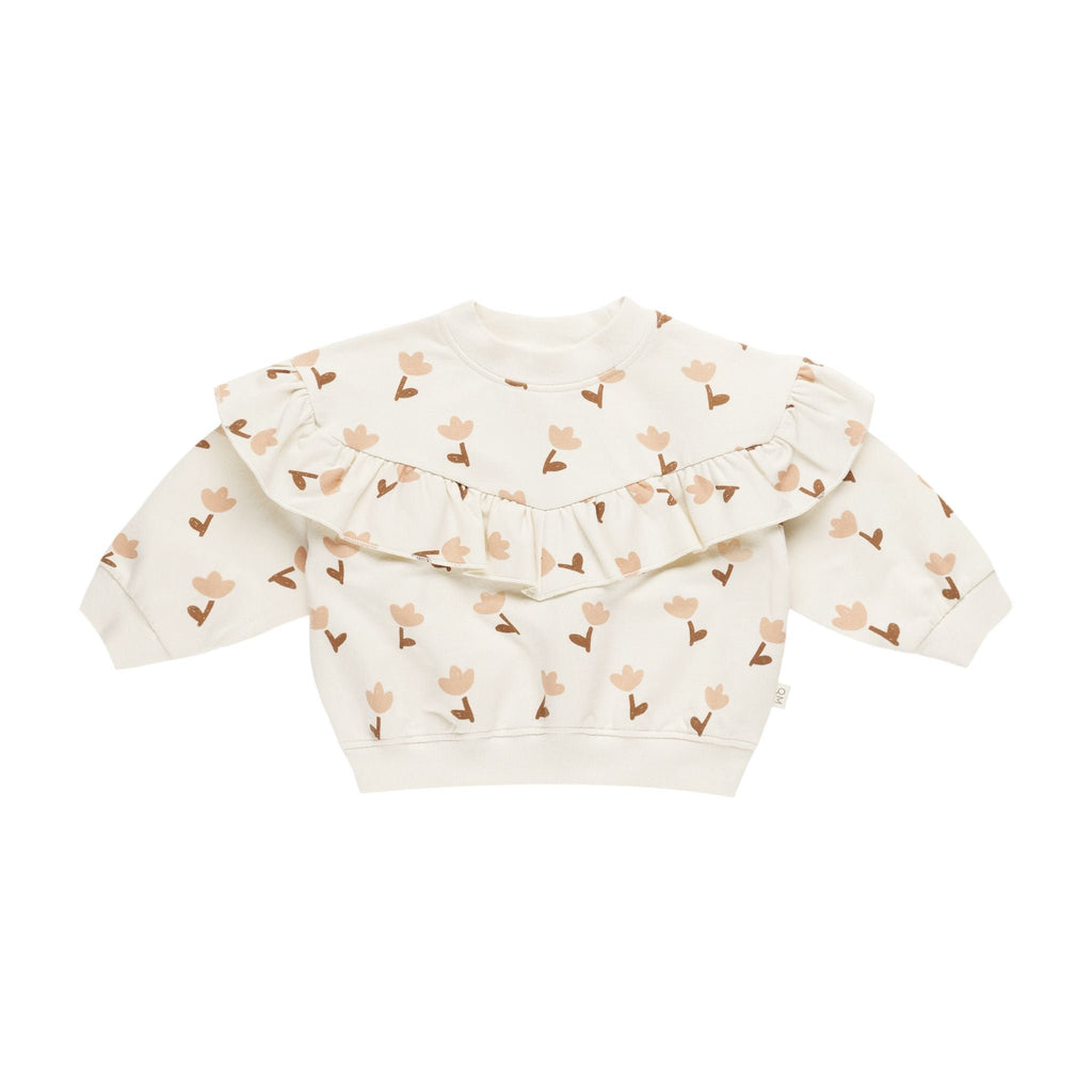 flatlay of sweatshirt withtulips on it on white background 