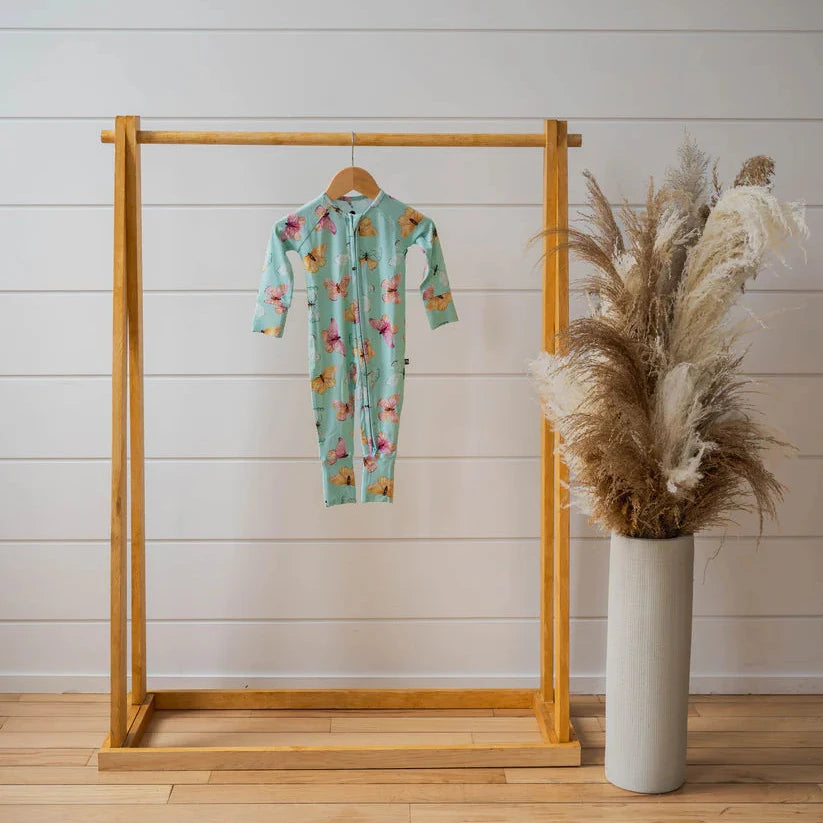 butterfly sleep on wood dowel rack with plant 