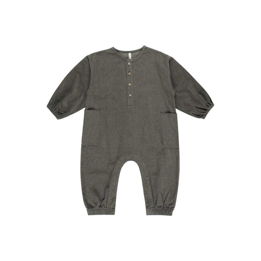 flatlay of corduroy forest jumpsuit on white background 