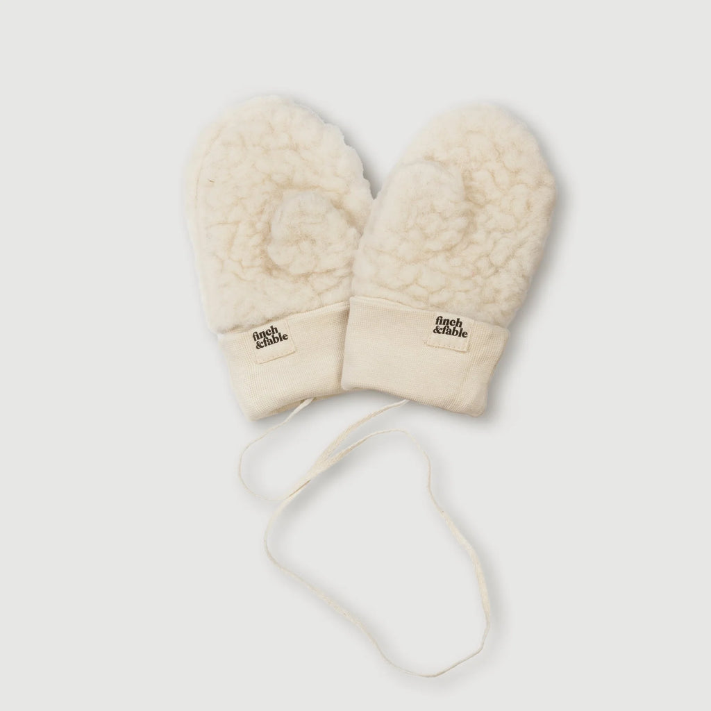 flatlay of milk mittens on white background