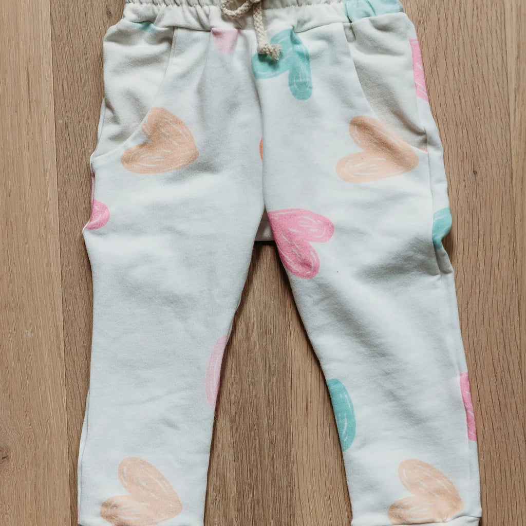 joggers with hearts flat lay