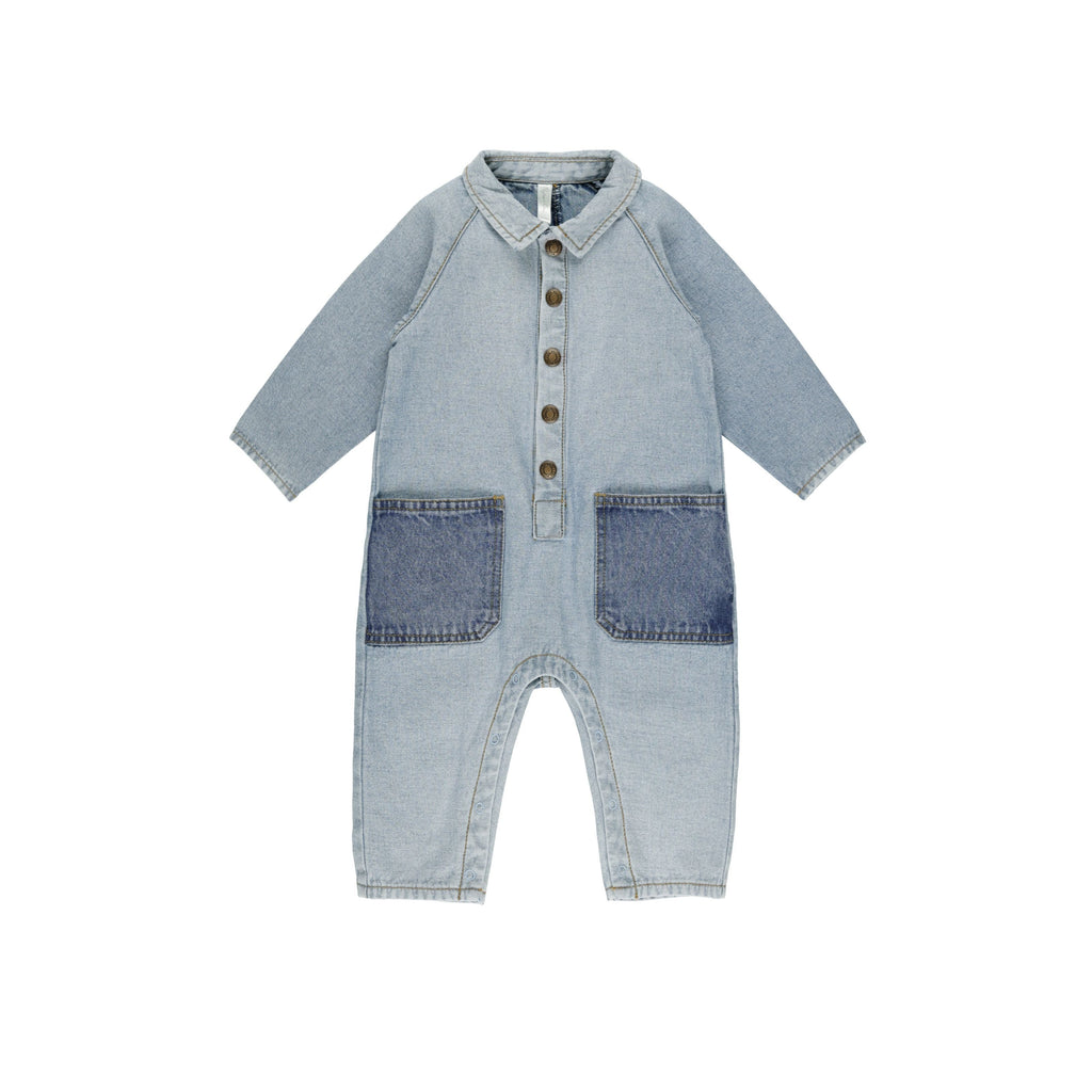 flatlay of denim jumpsuit on white background