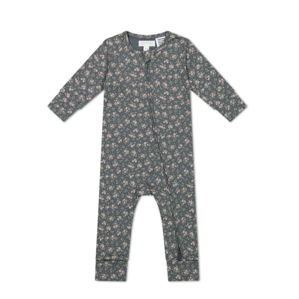 flatlay of floral romper on white background 