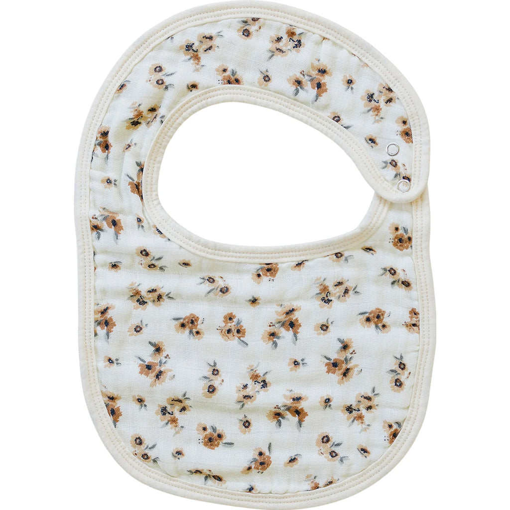 autumn bloom bib flatlay on white background 