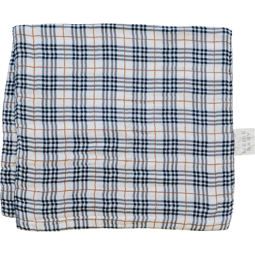 flatlay of the vintage plaid burp cloth on white background 