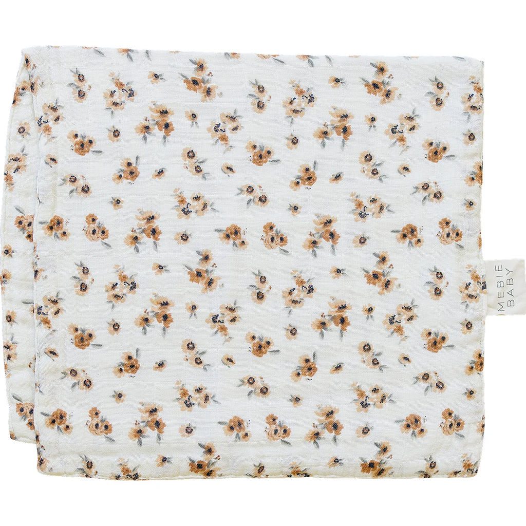 flatlay of burp cloth on white background 