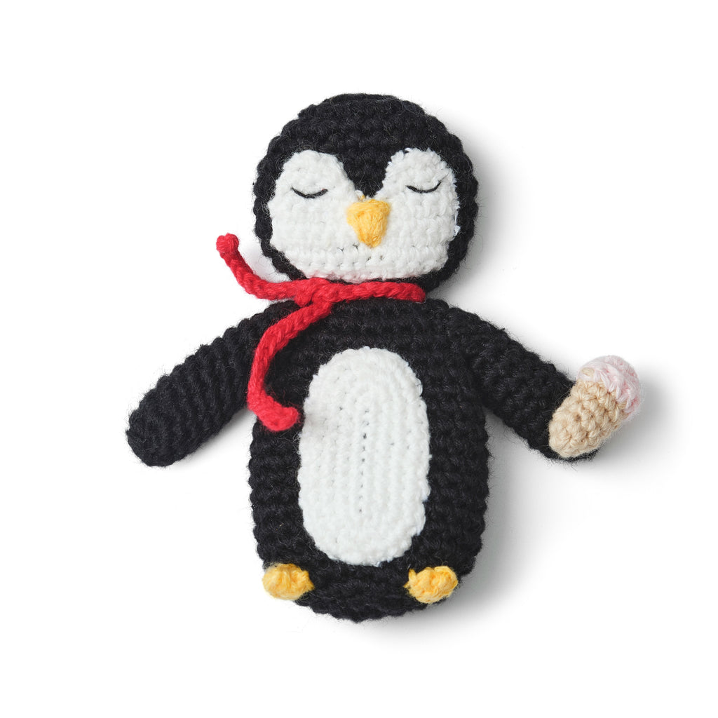 penguin pocket pal flatlay on white background 