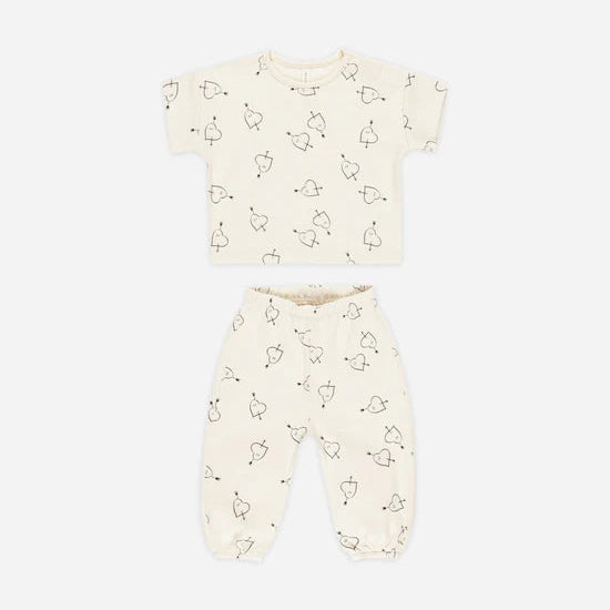 flatlay pf two piece cupid set on white background