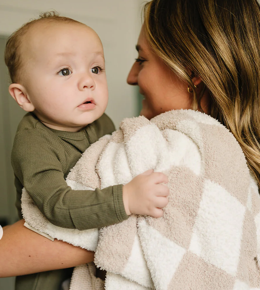 baby in mom's arms with blanket on shoulder Checkered Plush Blankets | Mebie Baby