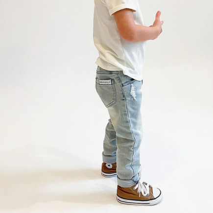 Slate Gray Denim Pants | Orcas Lucille ripped  jeans on toddler boy standing with brown shoes and white t-shirt