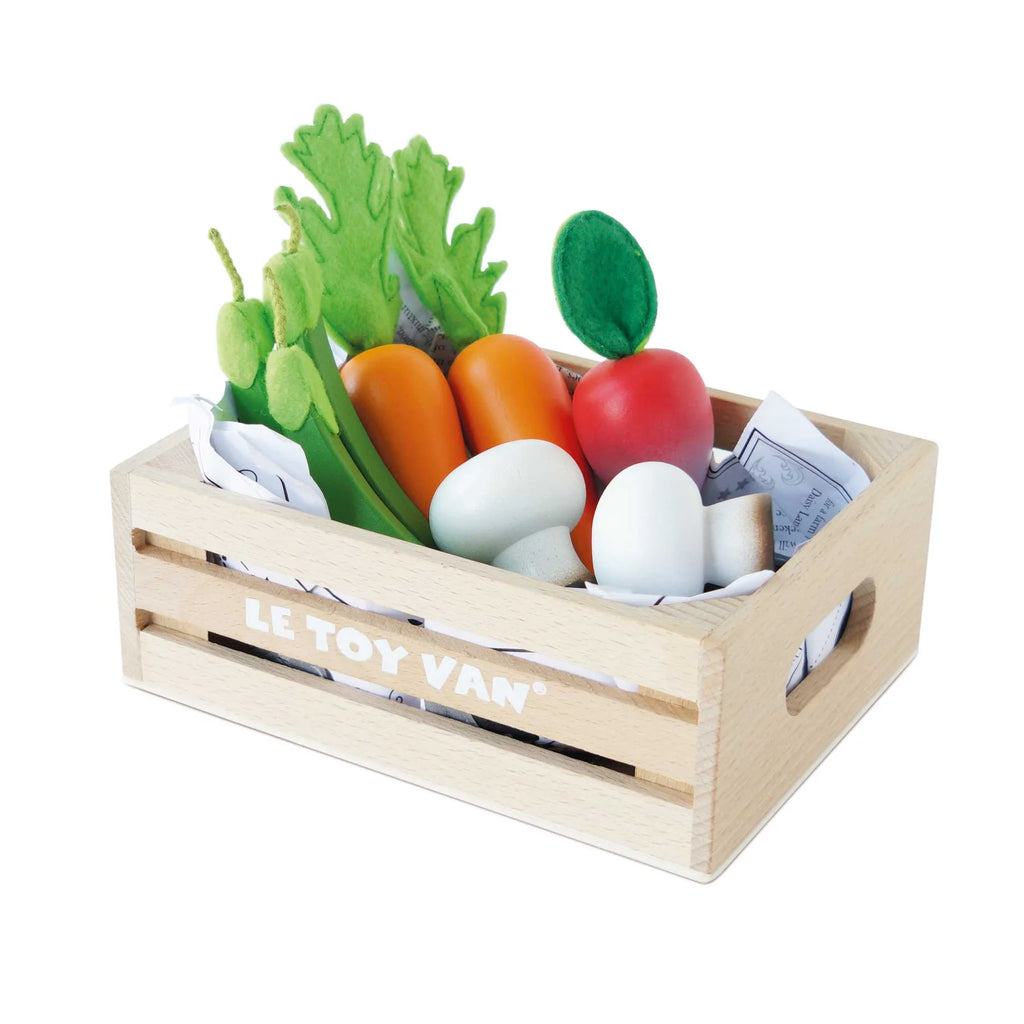 harvest vegetables in crate flatlay on white background 