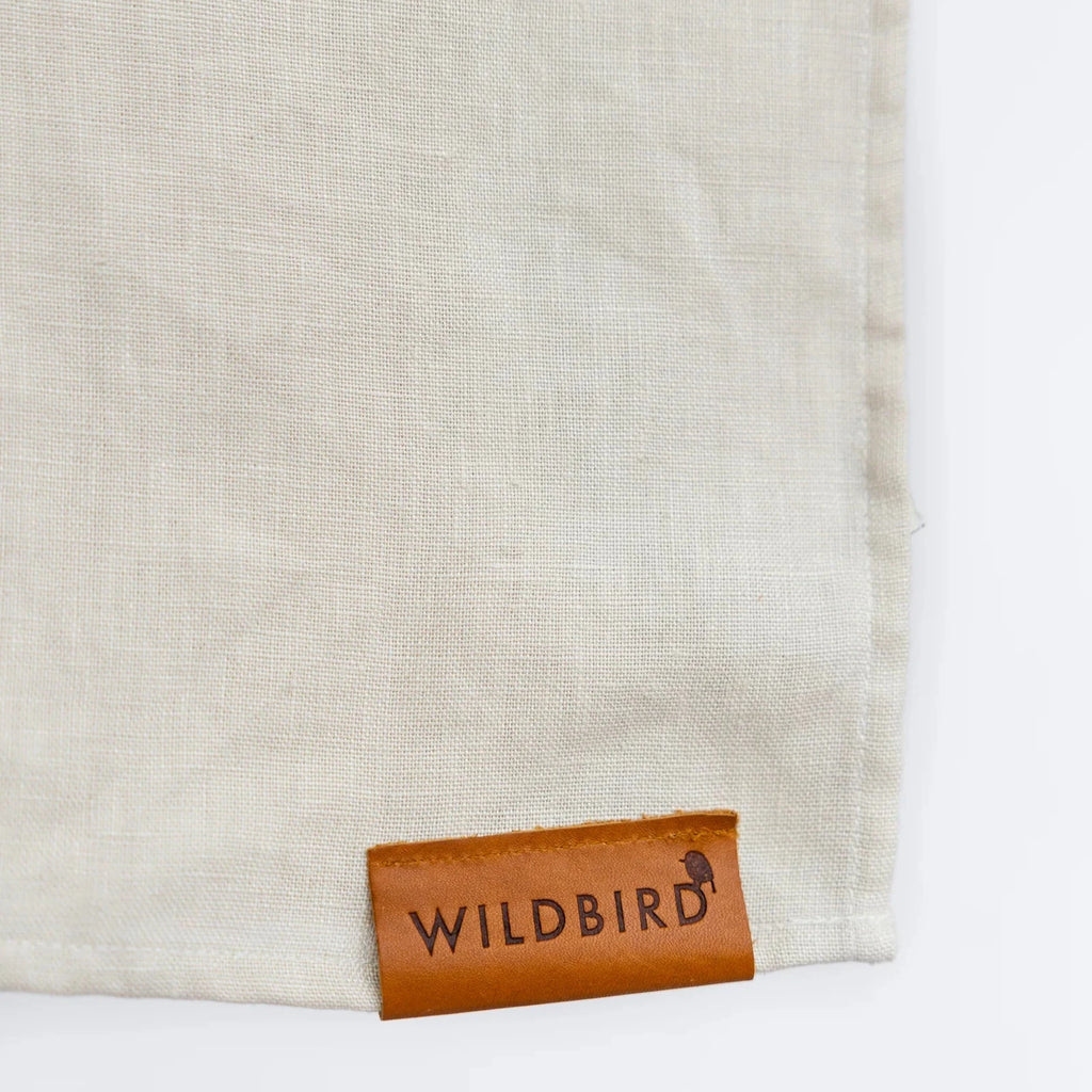 linen sling flatlay on white background 