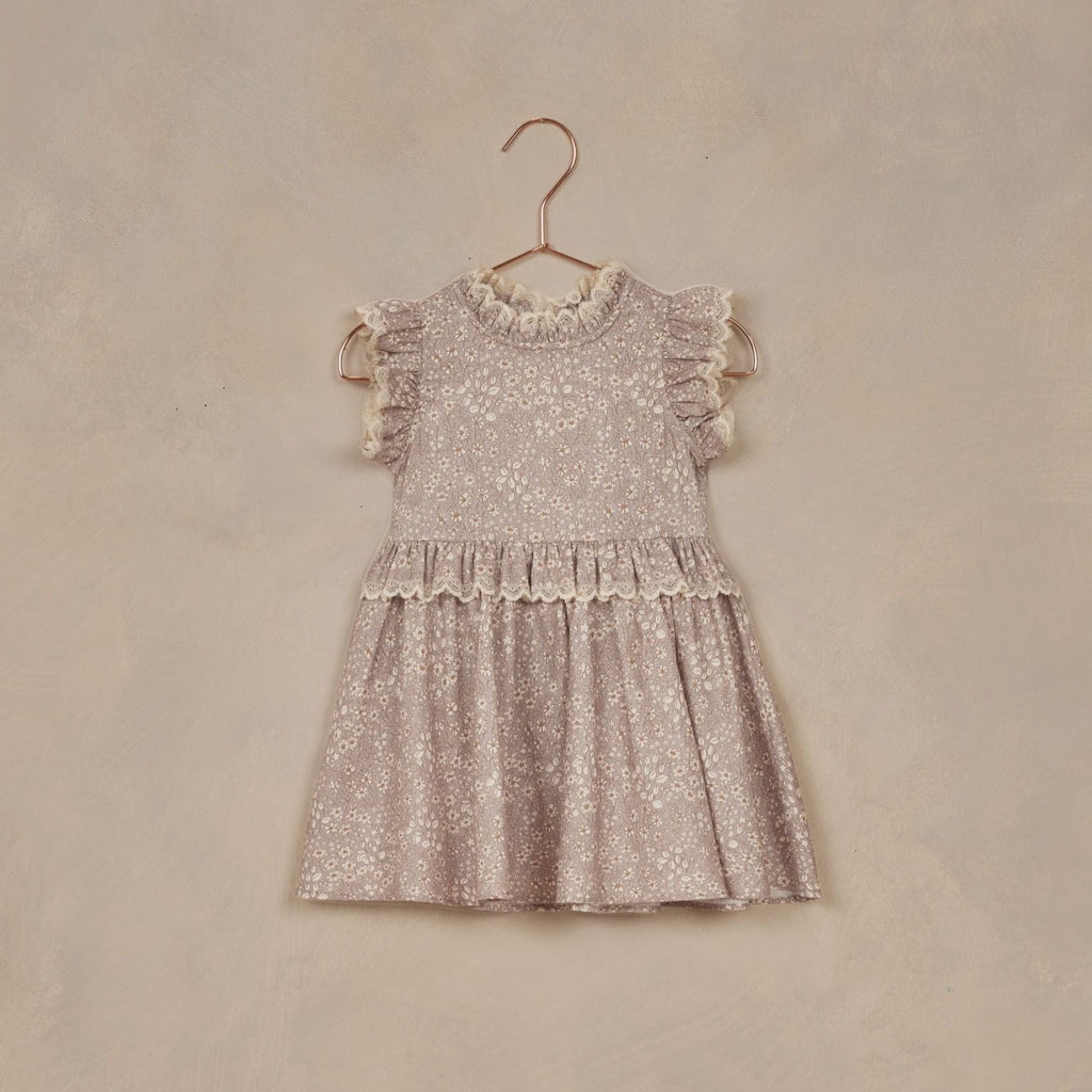lavender bloom dress on hanger with grey background 