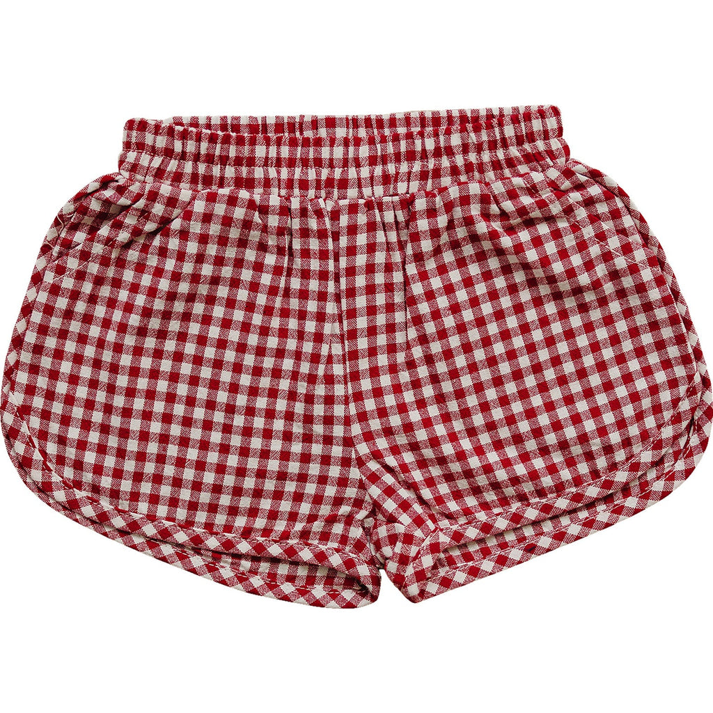 red gingham shorts on white background flatlay 