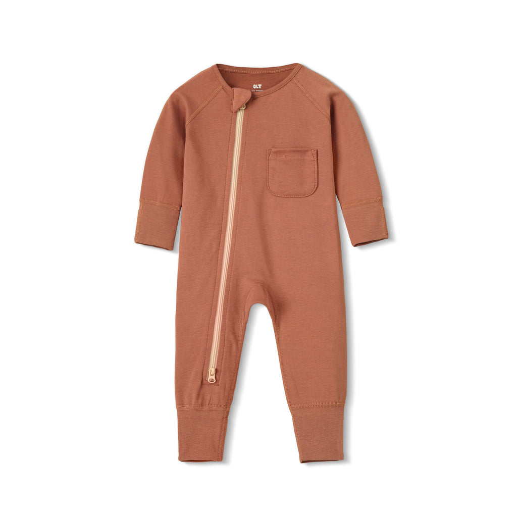 flatlay of chestnut zipper romper on white background 